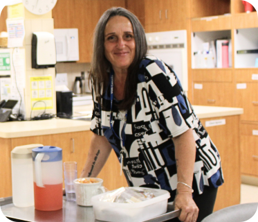 Crystal bringing a snack to ADP clients
