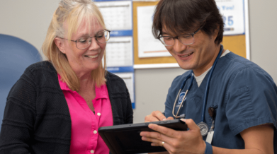 client and nurse look at von connect app together