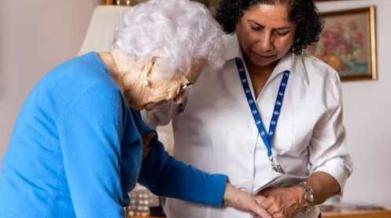 CCA assisting a client, walking