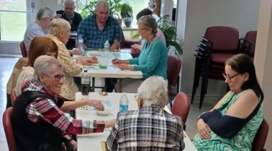 A group of people sitting at a table