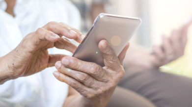 A person holding a phone scrolling. 