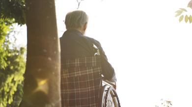 istock man outside in wheelchair